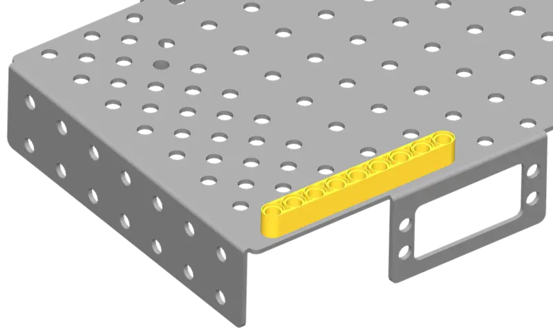 Line up the 1×9 liftarm on the short end of the chassis.